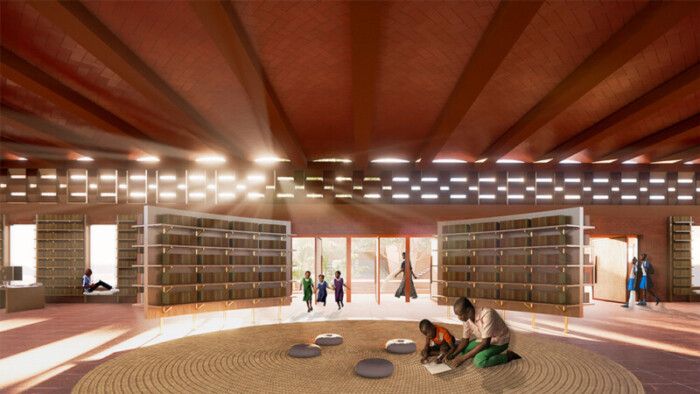 A rendering of a large open space with book shelves. Clerestory windows open to the outside and a series of doors lets in more light. A child and an adult sit reading on a mat on the floor.