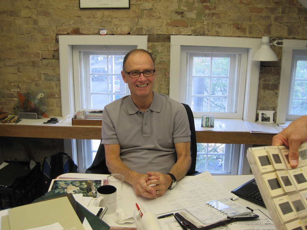 Smiling man sitting at work desk