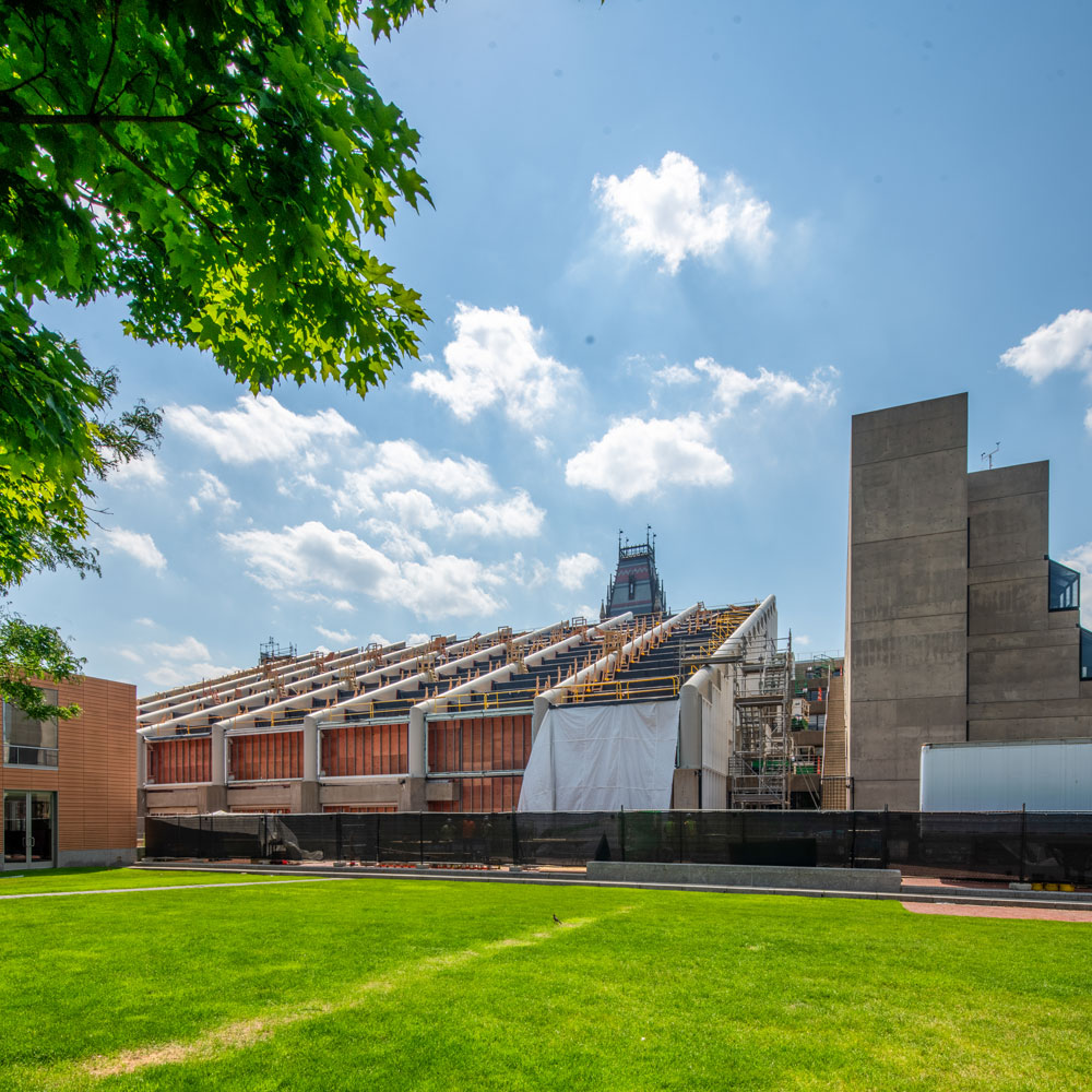 Gund Hall with view over backyard, under construction