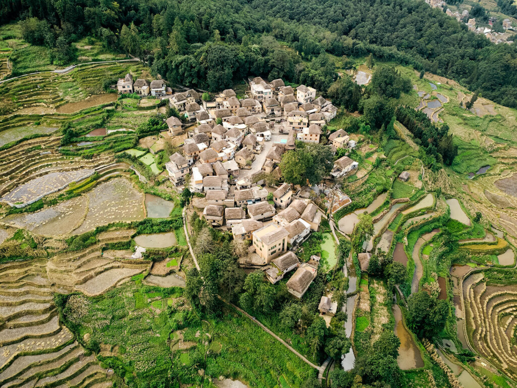 Houses with thatched roofs on a slope of a mountain